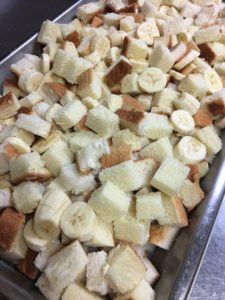 Banana slices and cubed bread for banana and caramel bread puddin