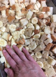 Gently press wet and dry ingredients together for bread pudding