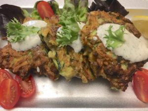 Plated Indian Spiced Zucchini & Beef Patties with Yogurt Sauce